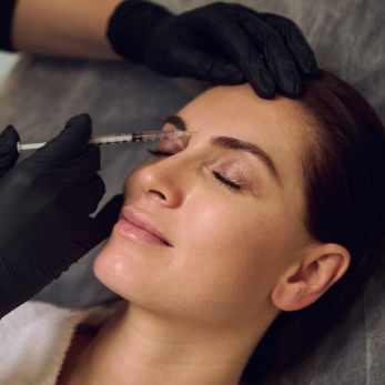 Botox being given to woman between brows